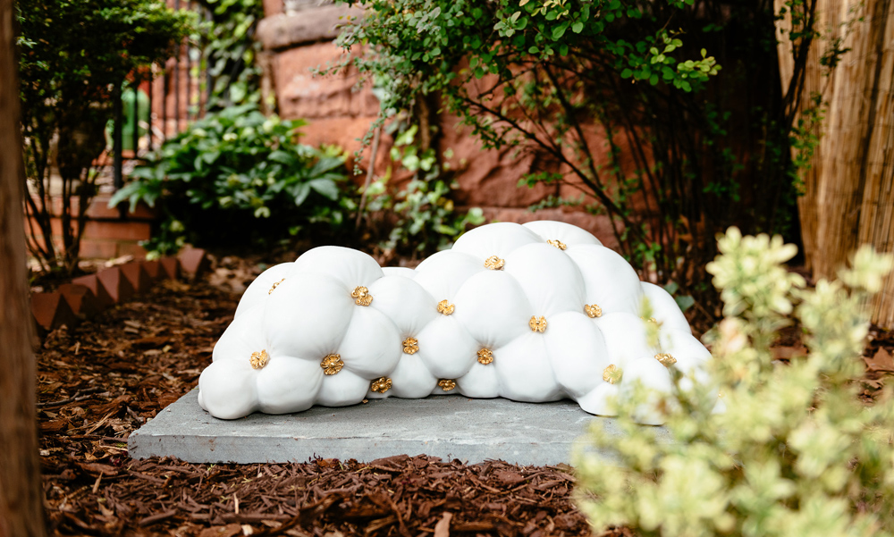 Jonathan Monaghan's 2015 marble sculpture with the appearance of soft fabric, installed in a outdoor sculpture biennial