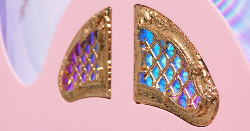 Beam Me Up, 2019, by Jonathan Monaghan, close-up of gold inlays with LED display visible behind them.