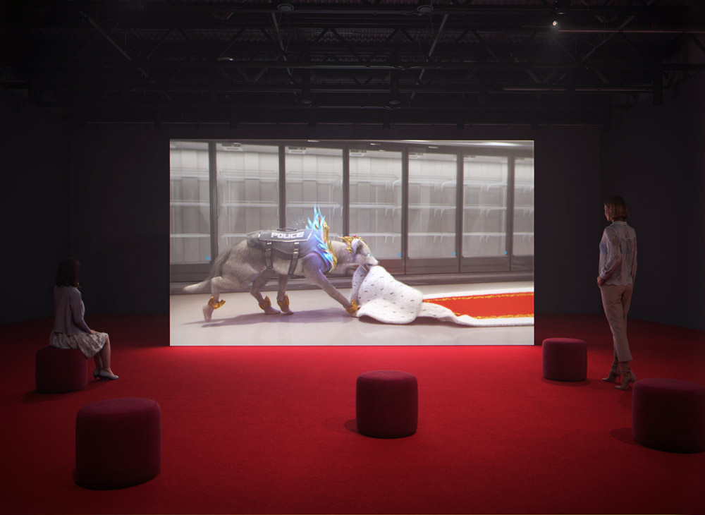 Video installation with red carpet and audience showing grey wolf
