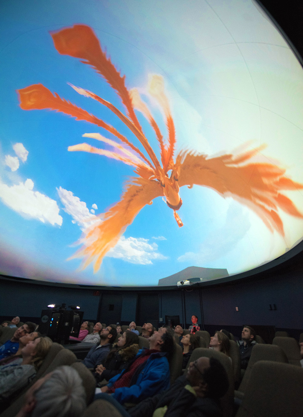 Artwork by Jonathan Monaghan featuring ambiguous electronic devices juxtaposed near colorful soft fabrics